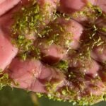 Wet duckweed on hand.