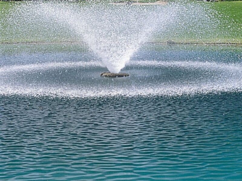 Aerating fountain running in pond.