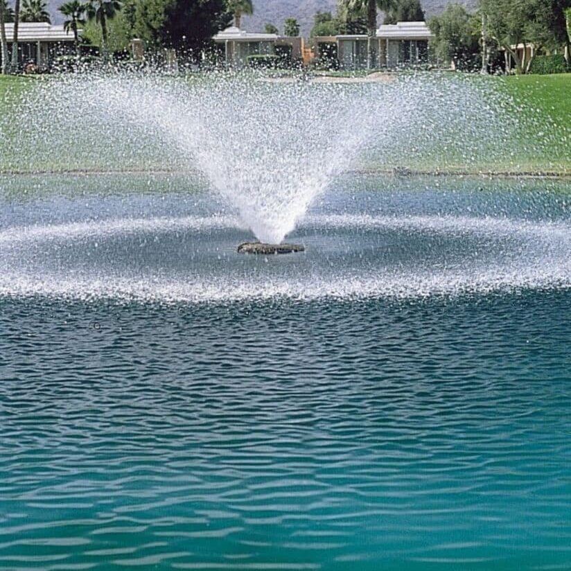 Aerating fountain running in pond.